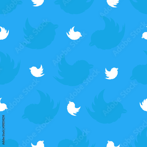 Seamless pattern from white birds on a light blue background