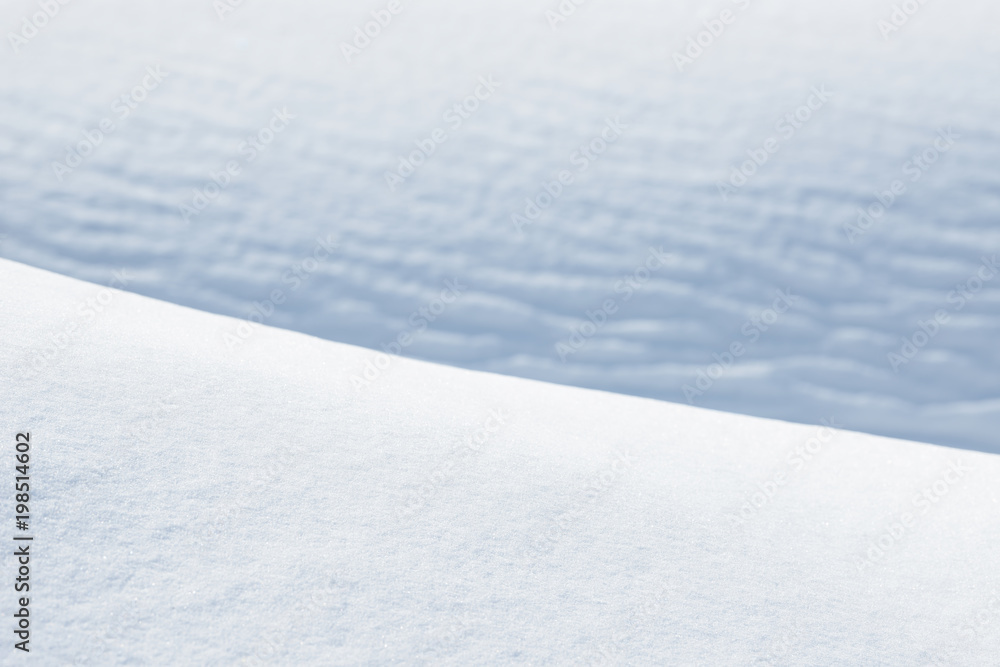 Fresh snow background texture. Winter background with snowflakes and snow mounds. Snow lumps