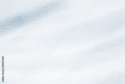 Fresh snow background texture. Winter background with snowflakes and snow mounds. © Сyrustr