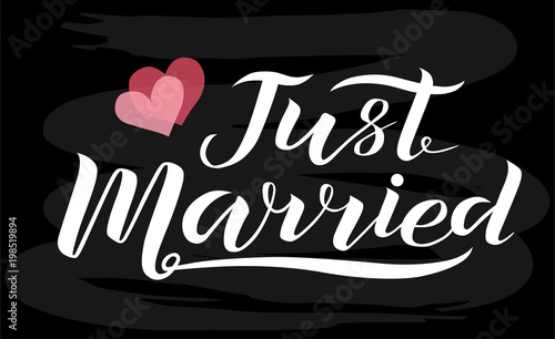 Hand drawn Just married white lettering text with hearts on chalkboard background, vector illustration. Just married for invitation and postcards. Wedding phrase. Just married calligraphy.