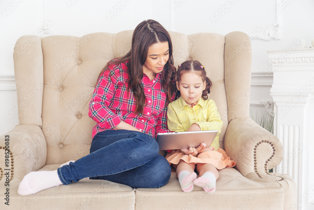 Mother with children learning computer tablet Mother with children learning computer tablet