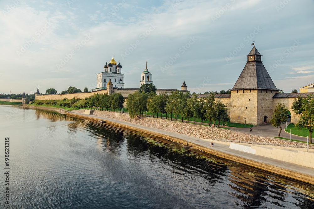 Ancient Pskov Kremlin on river bank, Trinity church, day time