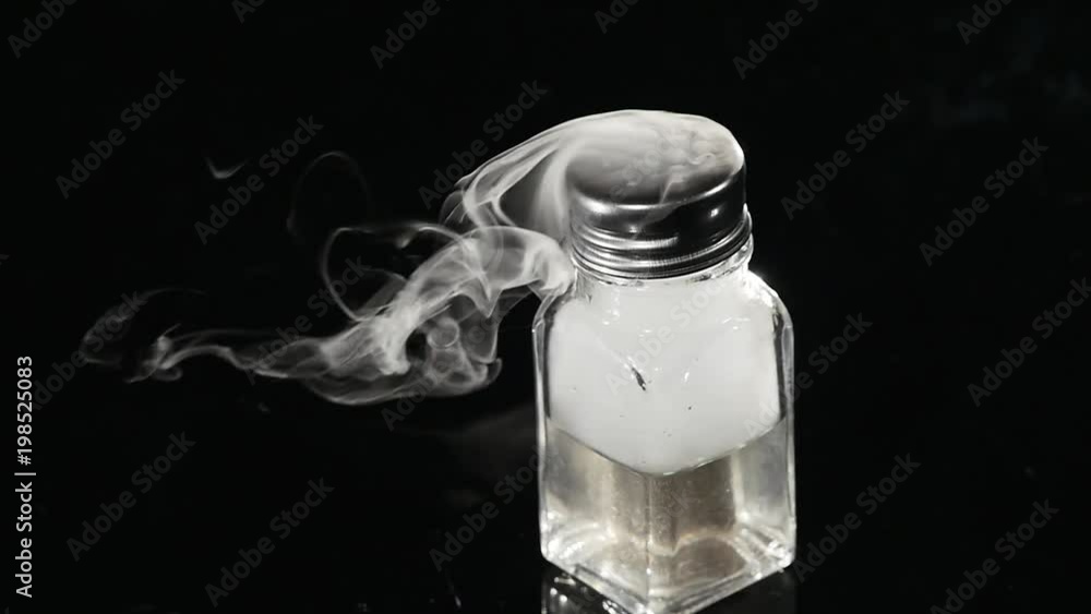 Abstract white smoke in glass the effect from dry ice on dark background Abstract white smoke in glass the effect from dry ice on dark background