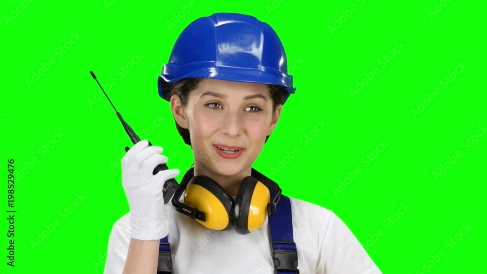 Bilder girl wearing wearing talks on the walkie talkie. Green screen. Close up Bilder girl wearing wearing talks on the walkie talkie. Green screen. Close up