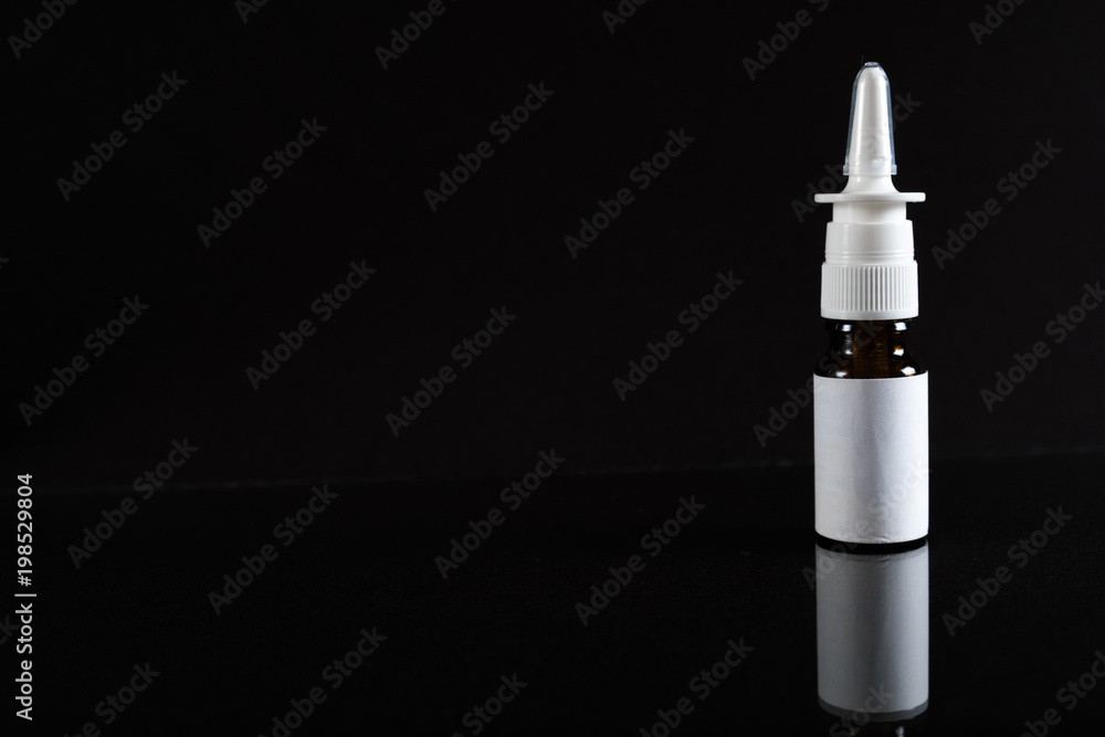 Nasal spray in isolated on black concept pharmacy. With copy space. Nasal spray in isolated on black concept pharmacy. With copy space.