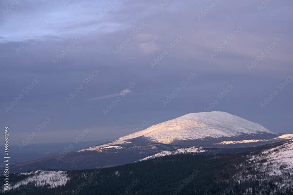 beautiful northern snowy winter mountain landscape in the Northern Urals