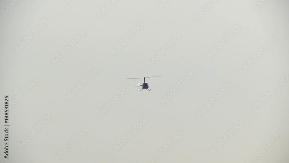 Helicopter flying in gray sky video Helicopter flying in gray sky video