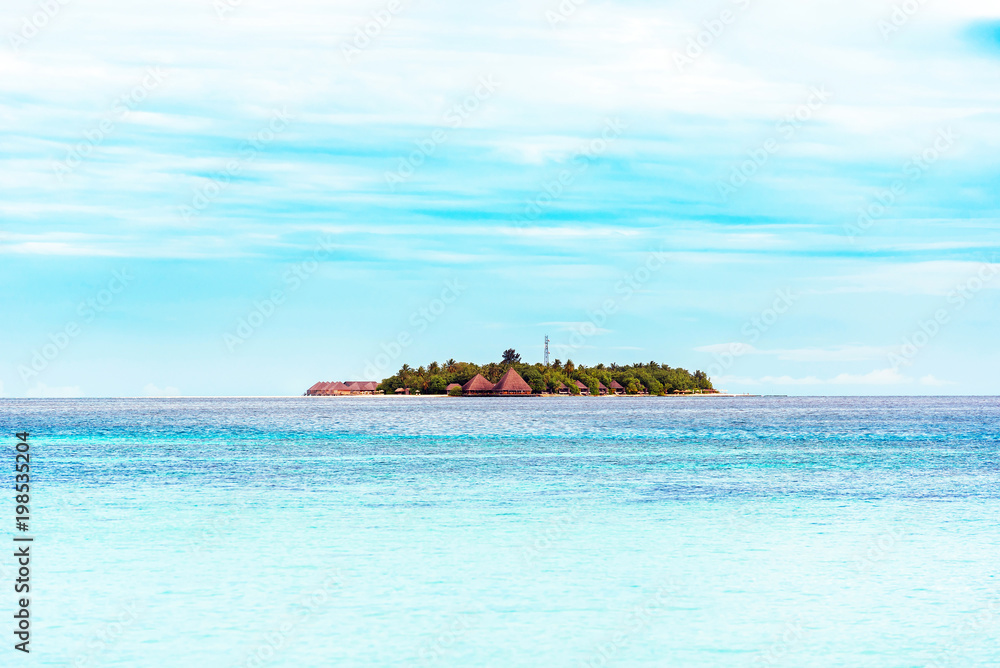 View of the tropical island of the Caribbean sea, Maldives. Copy space for text
