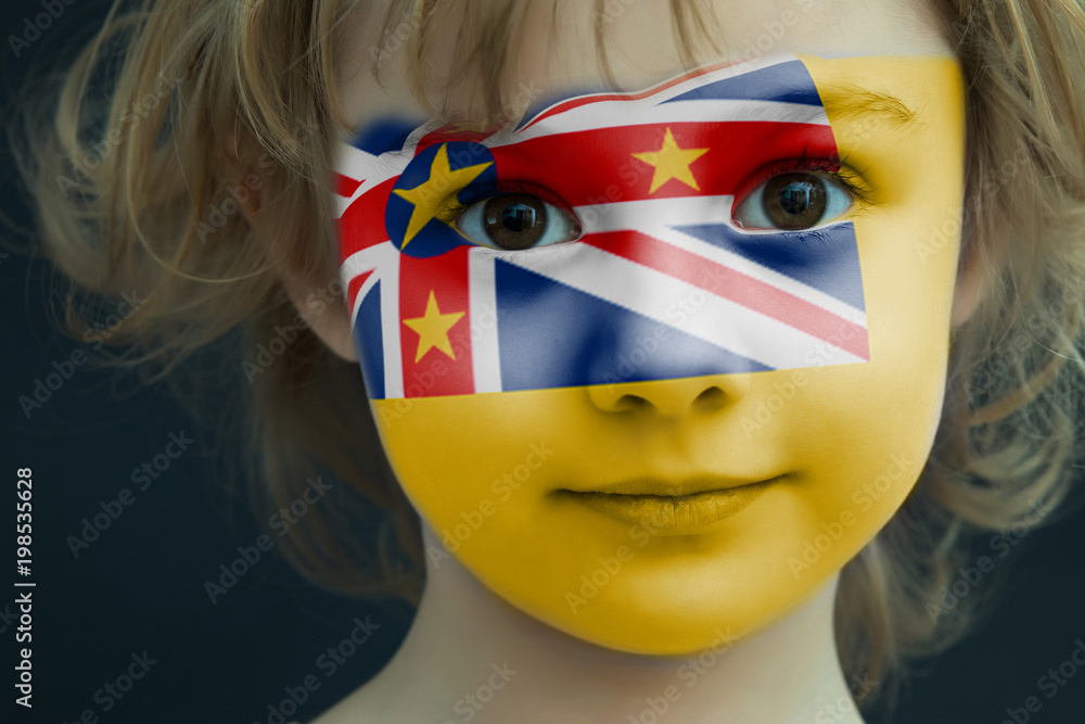 Portrait of a child with a painted Niue flag Portrait of a child with a painted Niue flag