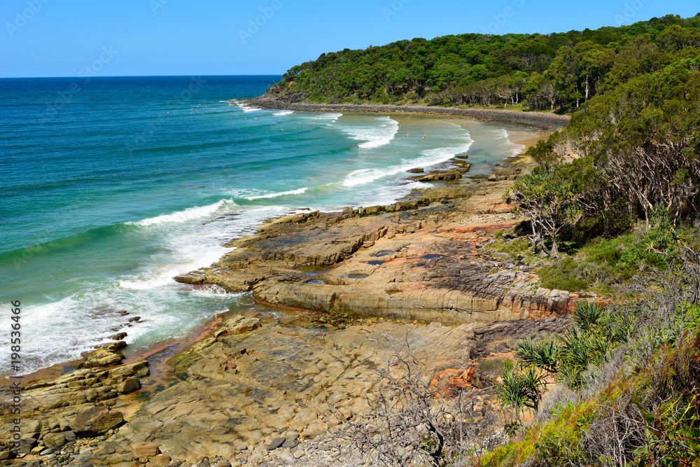 Rocky coastline of Tea Tree Bay in Noosa National Park in Queensland