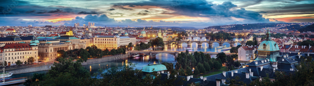 High quality sunset panoramic view of the Charles bridge on Vltava river and Old town in Prague, Czech republic.