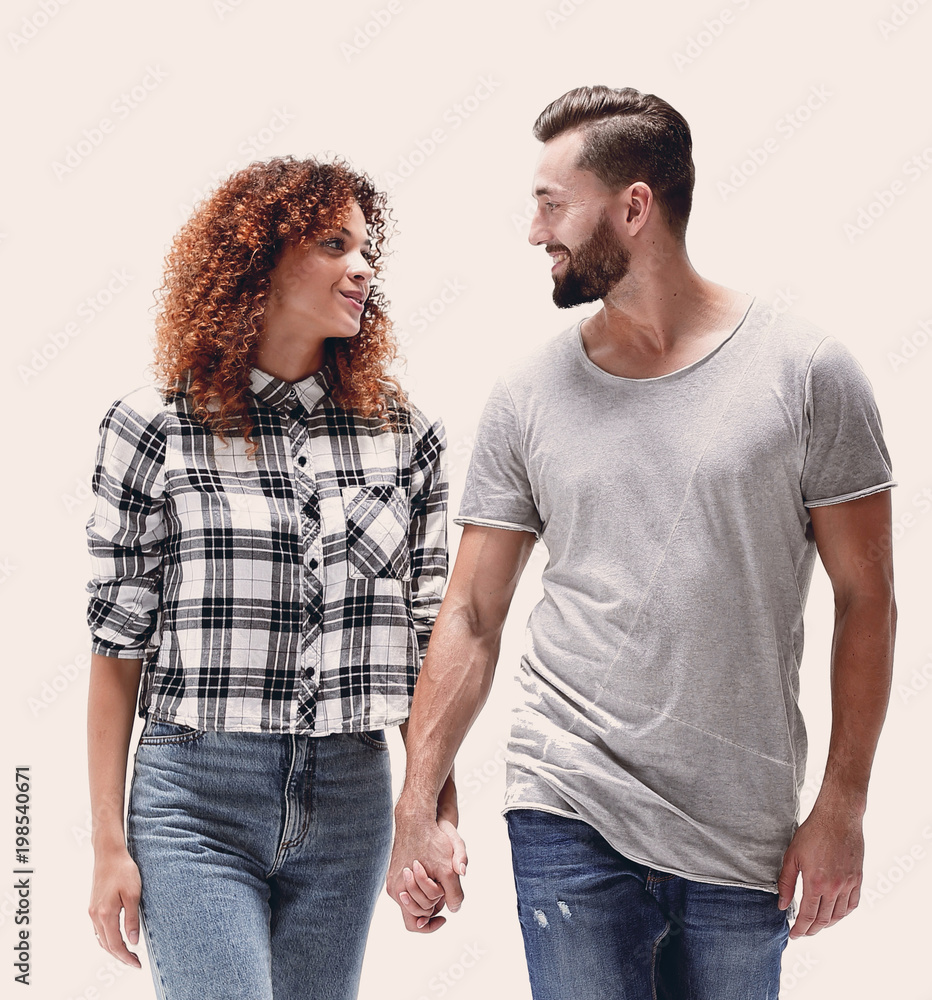 Fototapeta premium young people holding hands and walking forward.