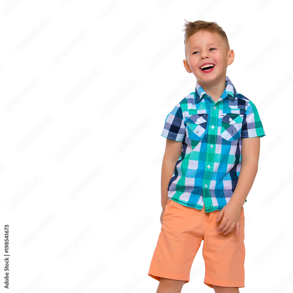 A cute little boy in a shirt and shorts. A cute little boy in a shirt and shorts.