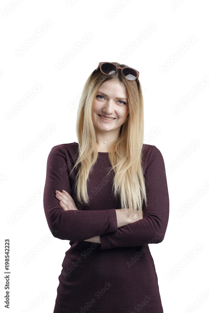 Portrait of young smiling female standing with folded hands over white background Portrait of young smiling female standing with folded hands over white background