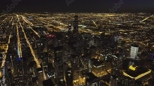 Chicago wide angle aerial view of the Chicago Loop at night featuring The Mart, Trump Tower and John Hancock Center