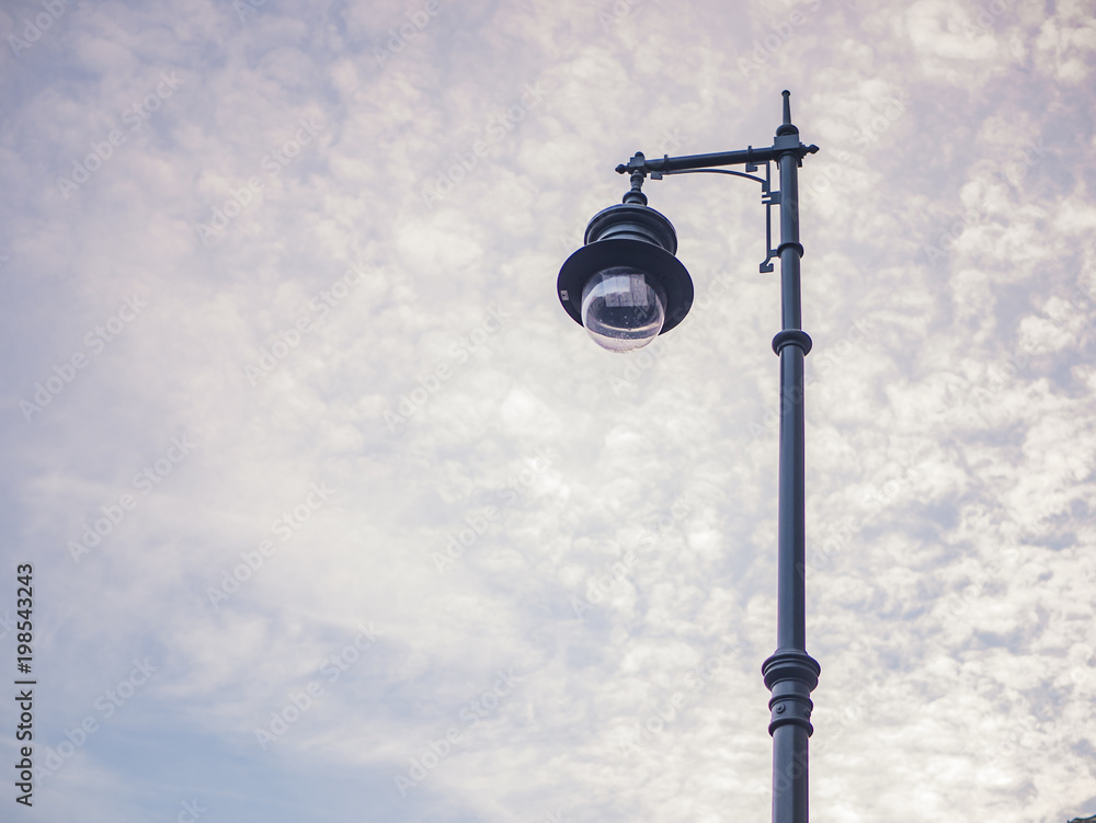 isolated light in the city street in the clouds sky background isolated light in the city street in the clouds sky background