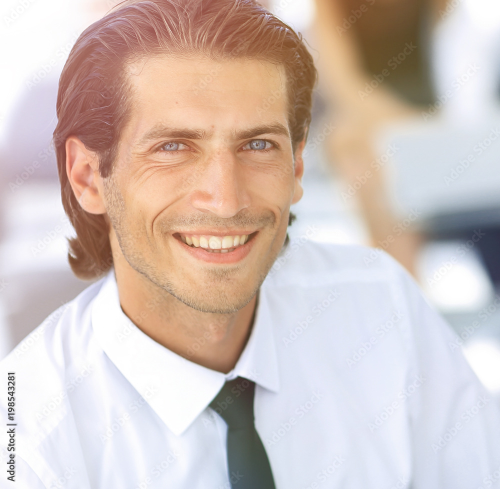Naklejka premium young businessman on background of office