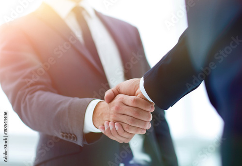 Two businessman shaking hands