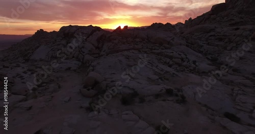 Right side over rocks evening sunset 1 of 8 - Drone Aerial Video 4K Arizona, Utah, Moab desert, open plain, trail, adventure, discovery landscape, reveal, beautiful, prairie, sun reveal beautiful.