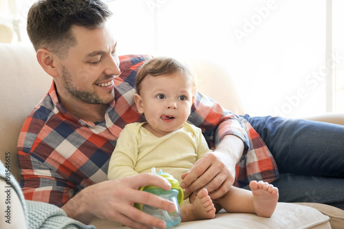Handsome dad with his littl...