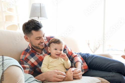 Handsome dad with his littl...