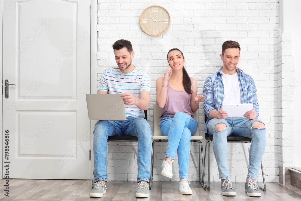 Group of people waiting for job interview, indoors Group of people waiting for job interview, indoors
