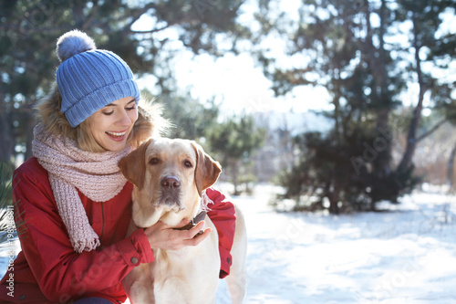 Woman with cute dog outdoor...