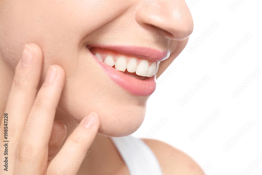 Young woman with beautiful smile on white background, closeup. Teeth whitening Young woman with beautiful smile on white background, closeup. Teeth whitening