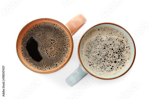 Cups with delicious hot coffee on white background