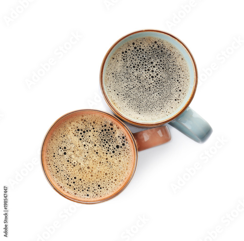 Cups with delicious hot coffee on white background