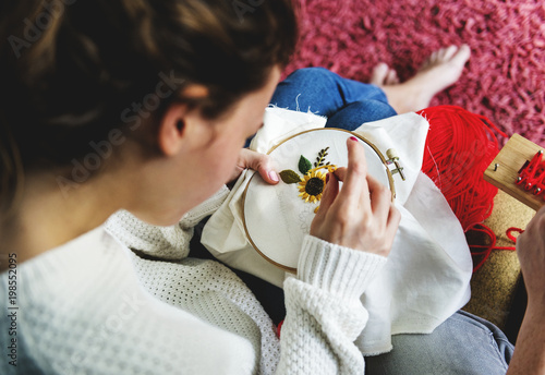 Young girl doing some needlework photo