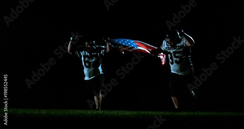 American football players in stadium during game