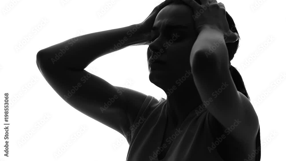 Woman touching head, migraine symptom, suffering strong pain, health problem Woman touching head, migraine symptom, suffering strong pain, health problem