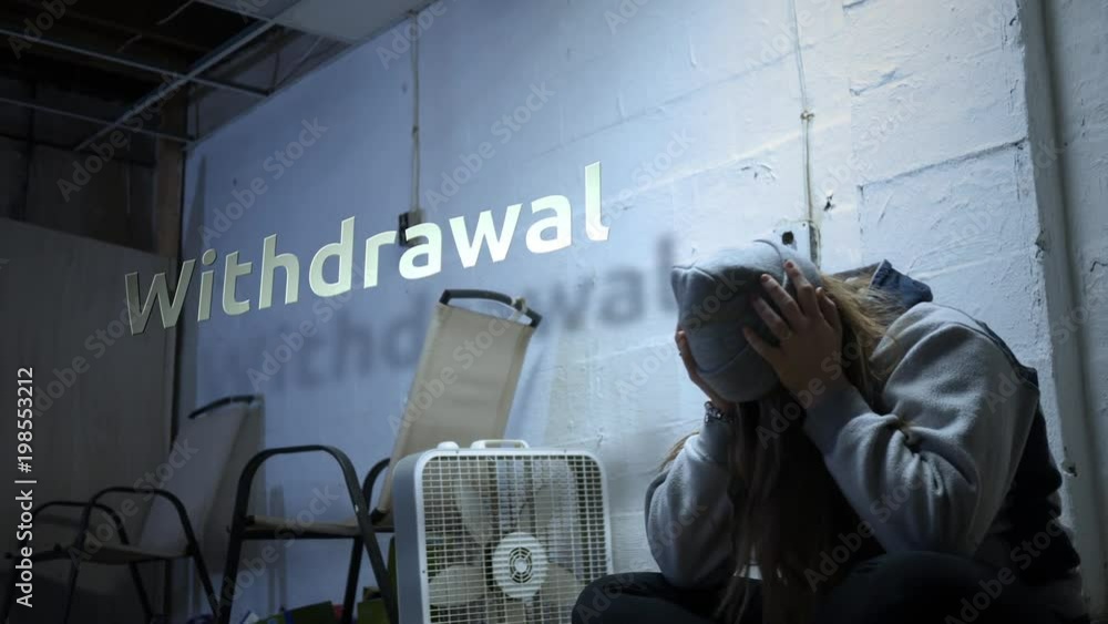 A addict is struggling with withdrawal symptoms with text - Withdrawal A addict is struggling with withdrawal symptoms with text - Withdrawal