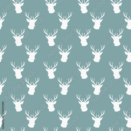 seamless winter pattern with silhouette of deer head with antlers. vector flat Christmas ornament on powder blue background