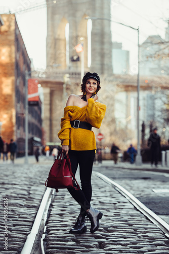 Photography Beautiful happy young fashionable woman traveling in New York City with backpack