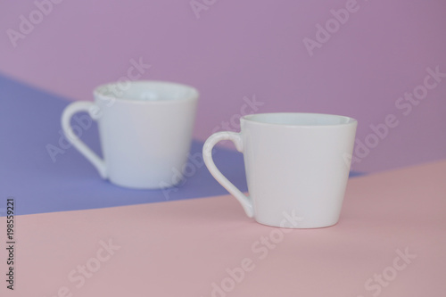 tableware mockup. Minimalist cup Mockup. white cups on a trendy graphic background in pastel colors.white cup on trend lilac pink graphic background. copy space