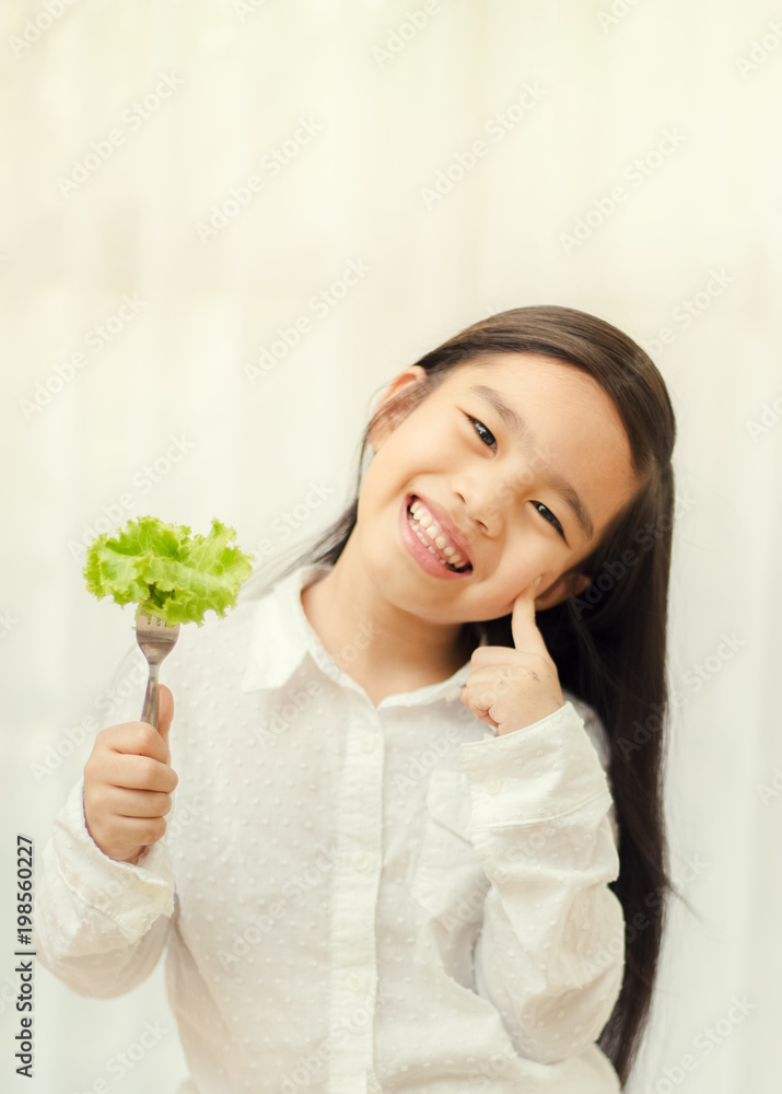 Asian cute girl eats fresh salad ,healthy eating concept Asian cute girl eats fresh salad ,healthy eating concept