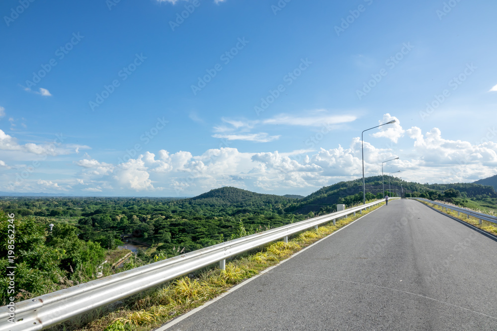 Road with blue sky clouds background