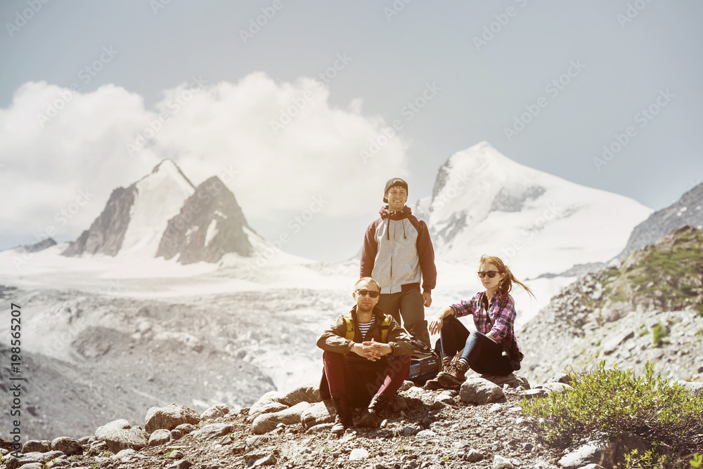 Fototapeta premium Three friends travel adventure mountains