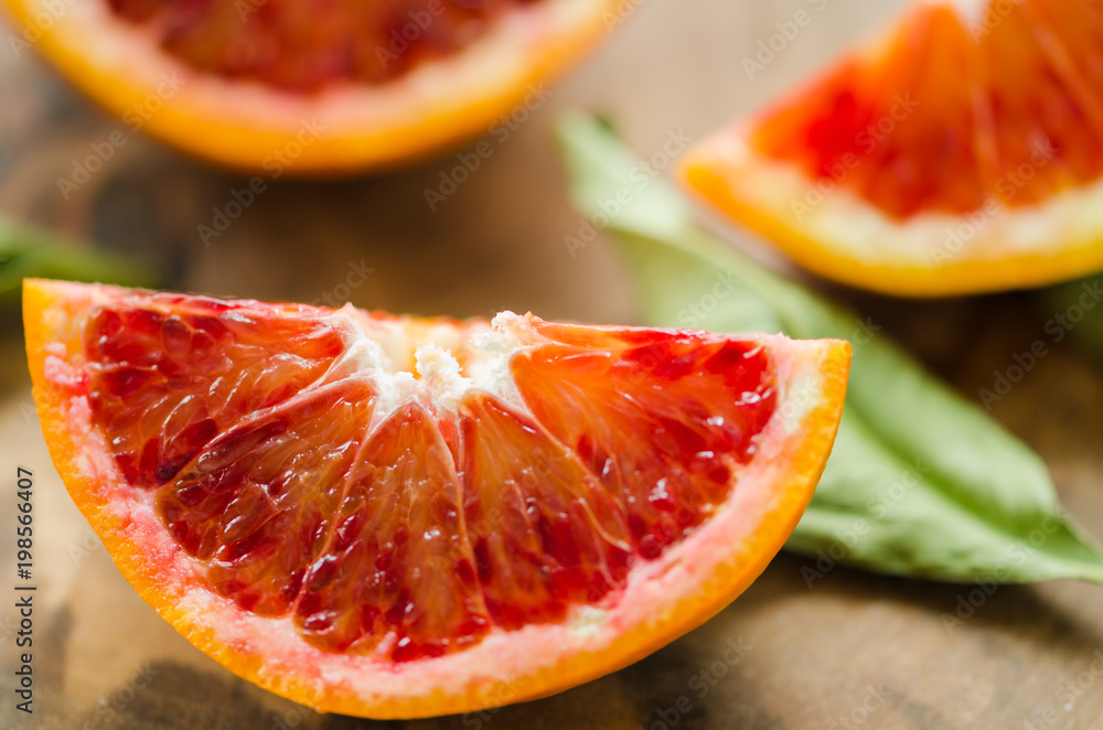 Sliced oranges on the wooden table. Citrus sinensis orange Sliced oranges on the wooden table. Citrus sinensis orange