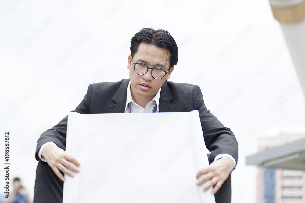 Businessman seated stress after encountering problems, economy and administration errors. Businessman seated stress after encountering problems, economy and administration errors.