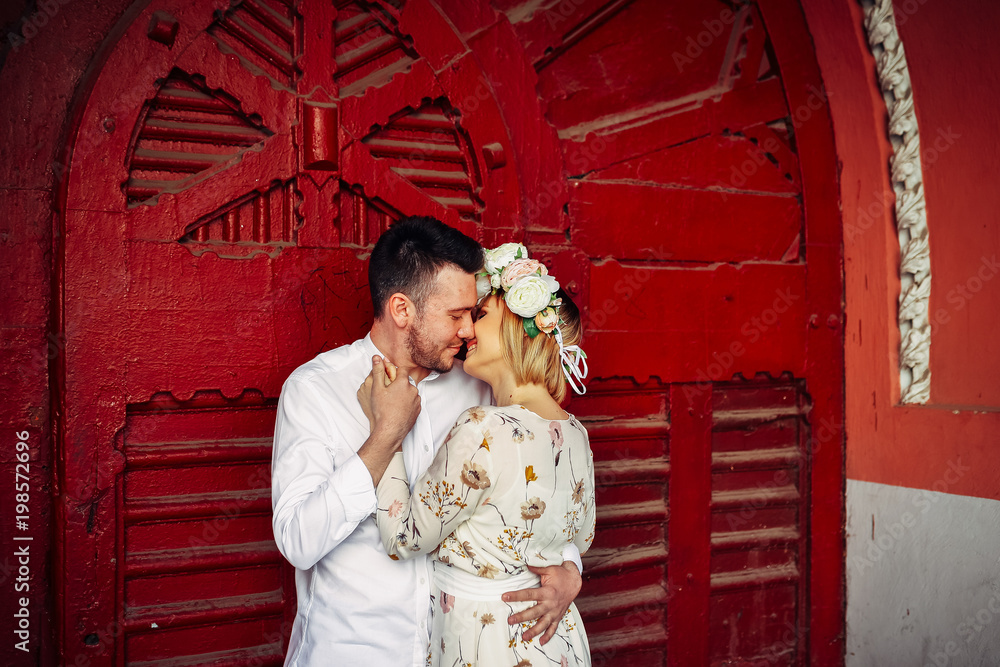 Fototapeta premium Beautiful couple holding tight and kissing