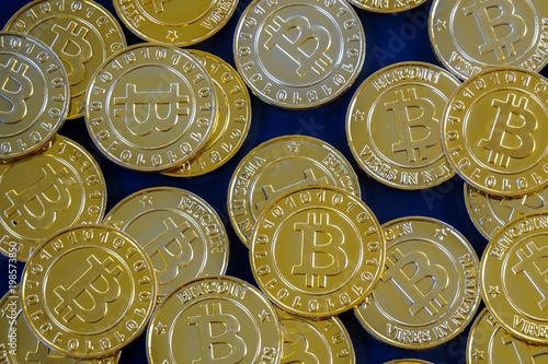 Golden bitcoins with selective focus .New virtual money.