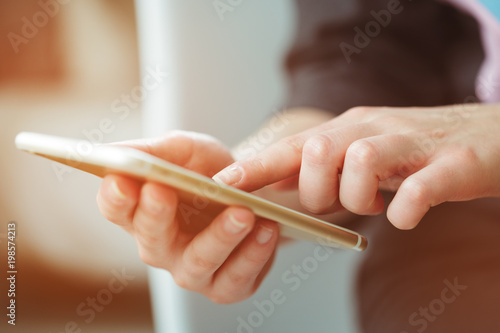 Woman typing write message on smart phone