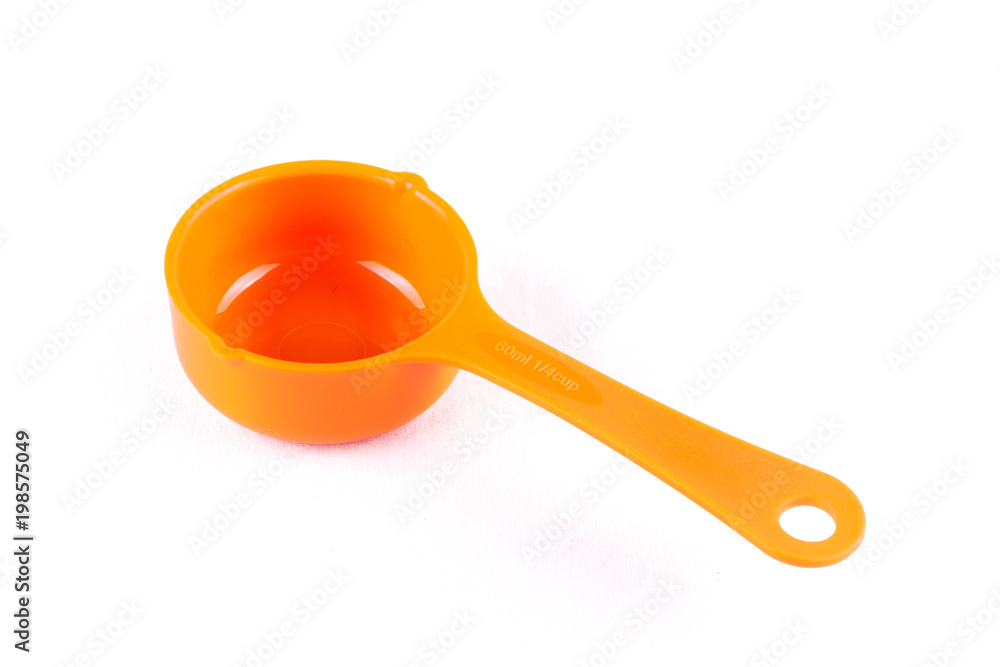Measuring spoon or cup over the white background. Measuring spoon or cup over the white background.