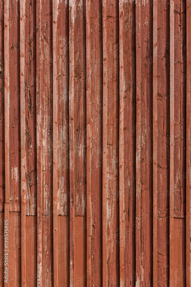 Old and weathered red painted wooden wall Old and weathered red painted wooden wall
