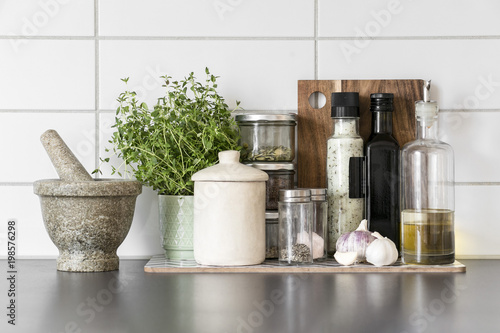 Fresh herbs and spices in clean, modern kitchen