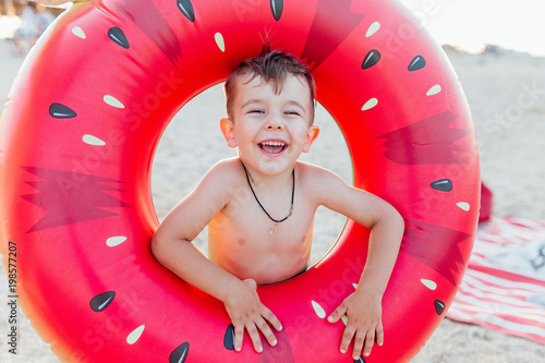 Happy little boy with inflatable ring