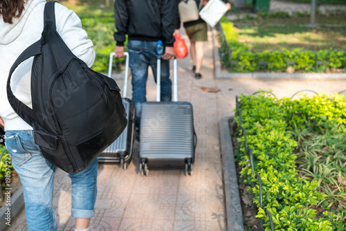 Bag or luggage of traveller walking in garden park
